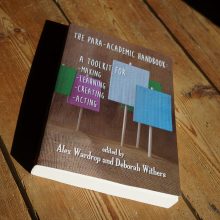 Para-Academic Handbook cover, a series of blank placards, photograph by Rachael House
