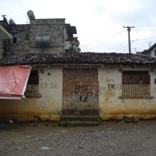 Abandoned building with graffitti on exterior