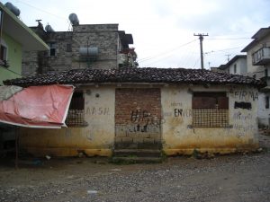 Abandoned building with graffitti on exterior